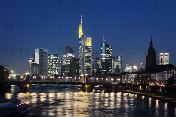 Illuminated riverfront skyline