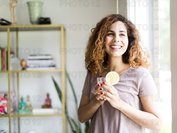 Woman holding drinking glass