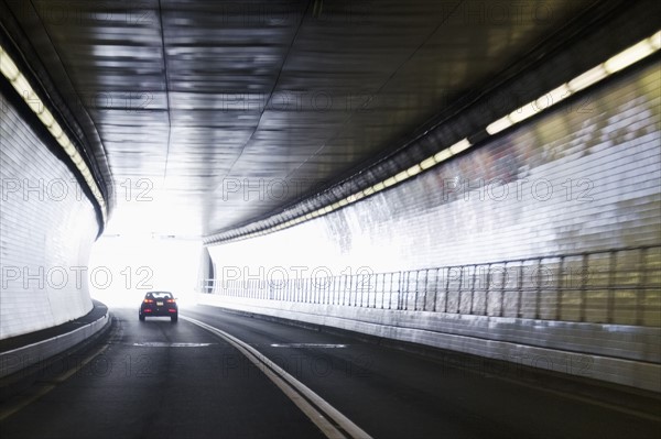 Car driving in tunnel