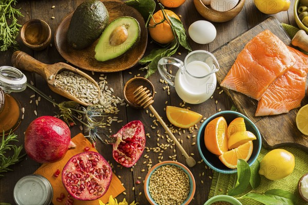 Overhead view of messy table with various fruits and seeds