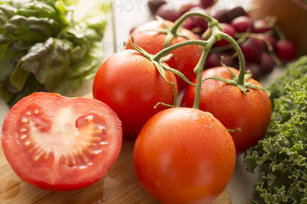 Red tomatoes on cutting board