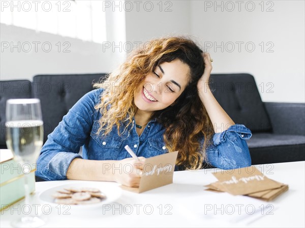 Woman handwriting in living room