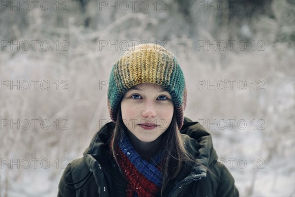 Teenage girl with colorful woollen hat during winter