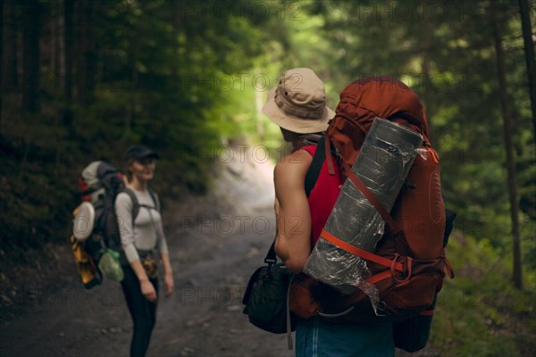 Couple hiking in forest at the Carpathian Mountain Range, Ukraine