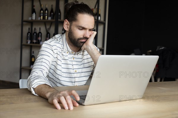 Young businessman using laptop