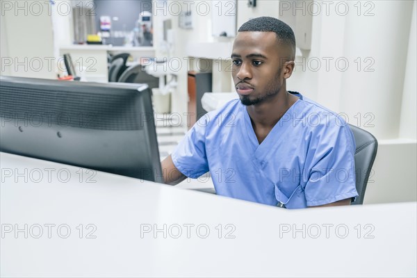 Nurse using computer in hospital