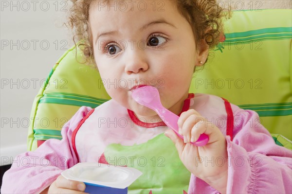 Girl eating yoghurt