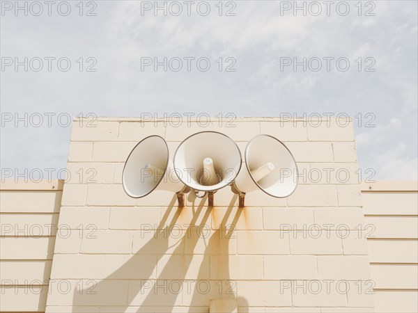 Three loudspeakers on wall