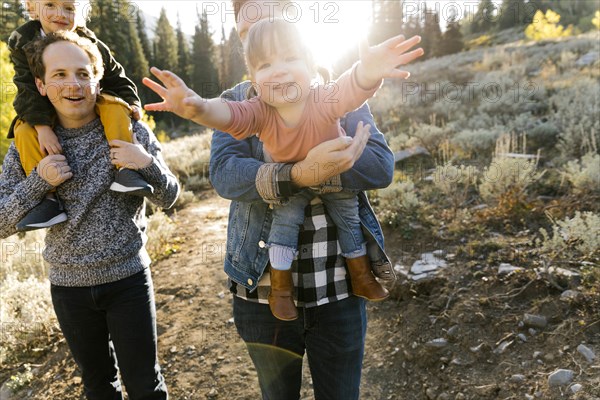 Two fathers and daughters while hiking