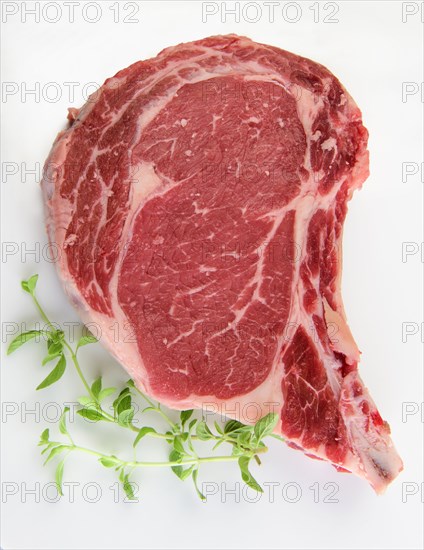 Raw steak and oregano