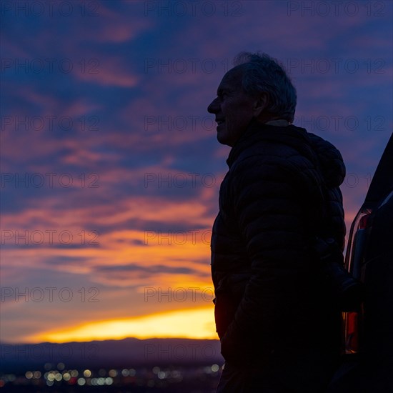 Silhouette of senior man at sunset