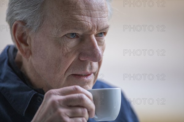 Senior man with coffee cup