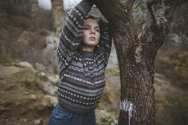 Ukraine, Crimea, Portrait of young woman in sweater