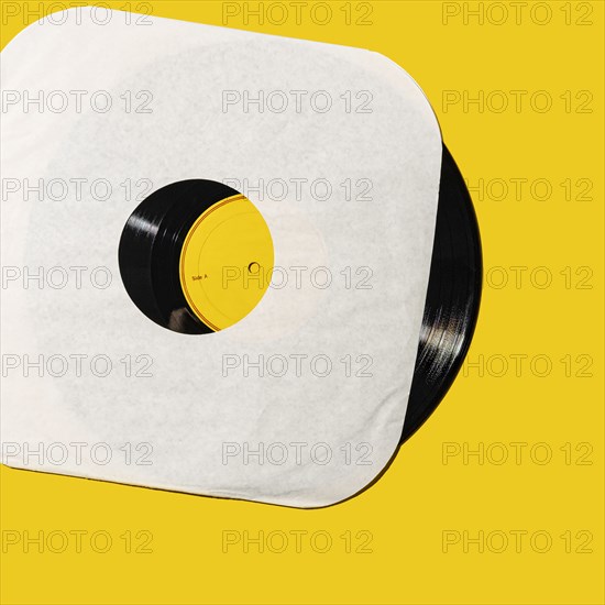 Vintage record on yellow background