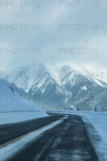 Road through snowy mountains