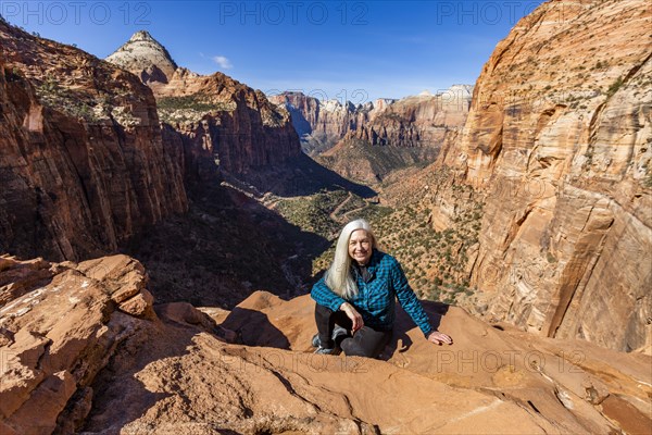 Senior woman at overlook above Zion Canyon in Zion National Park