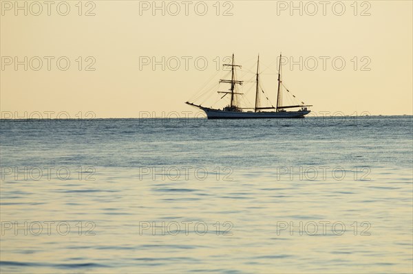 Tall ship sailing on ocean