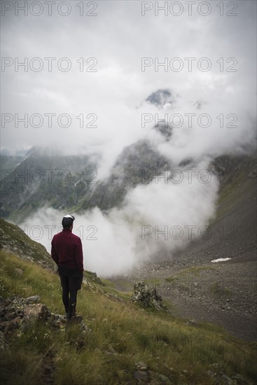 Man hiking in Swiss Alps