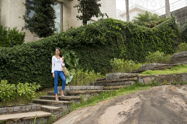 Woman standing on stone steps