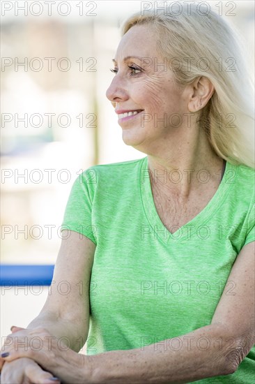 Wind blowing hair of smiling Caucasian woman