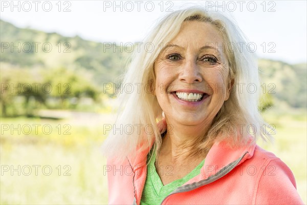 Portrait of smiling Older Caucasian woman outdoors
