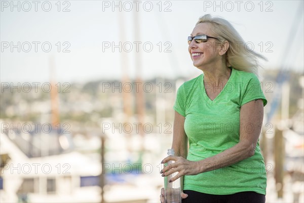 Wind blowing hair of older Caucasian woman