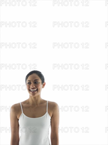 Waist up view of smiling woman standing