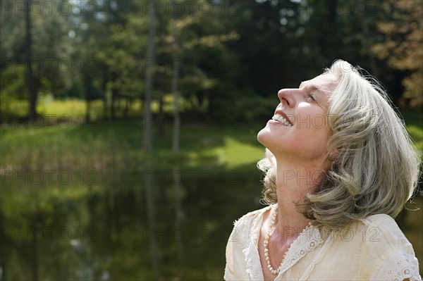 Older woman standing in park