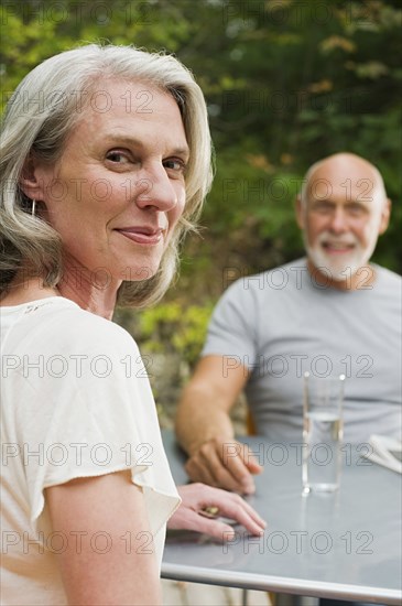 Older Couple Sitting At Table Outdoors Photo12 Tetra Images Alberto Guglielmi
