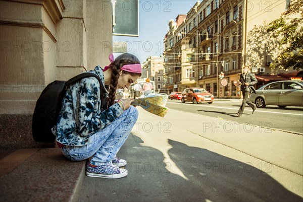 Caucasian woman reading map in Ykaterinberg