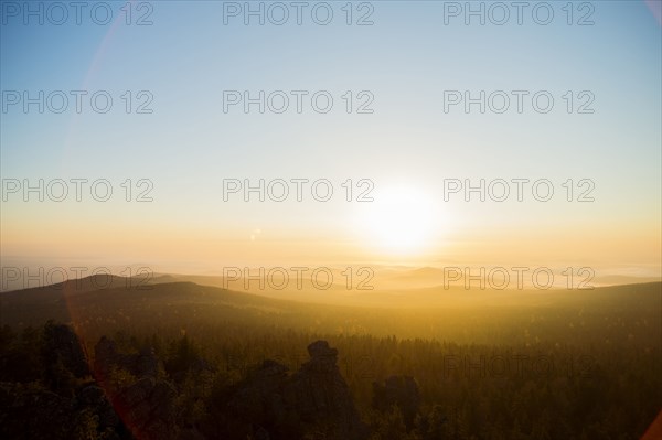 Sunrise over hills in remote landscape