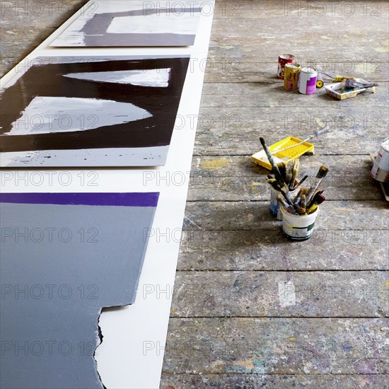 Paint supplies on floor of art studio