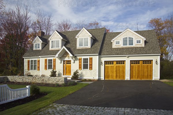 Driveway leading towards garage of single family home