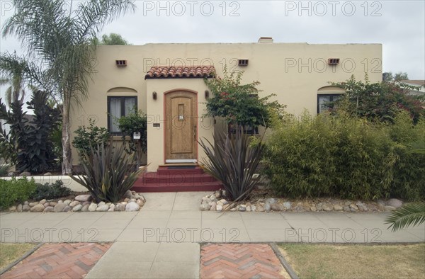 Exterior one story Spanish Colonial Revival home