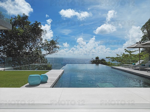 Swimming pool on ocean at modern home