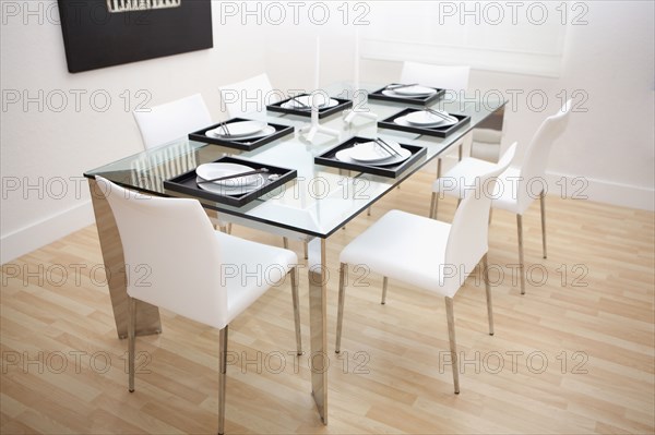 Set table and chairs in modern dining room