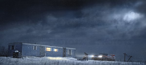 Man and car parked by illuminated trailer