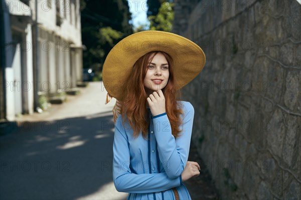 Pensive Caucasian Woman Wearing Hat Near Stone Wall Photo12 Tetra Images Dmitry Ageev