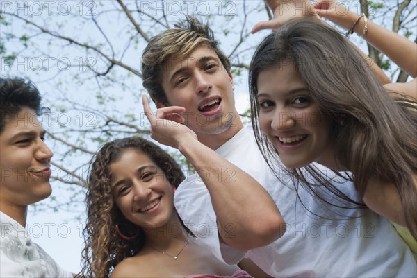 Playful Hispanic friends smiling