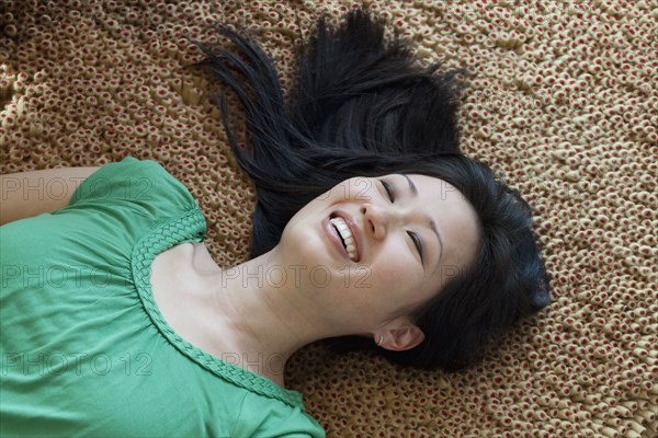 Korean woman laying on floor