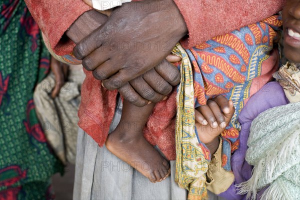 Close up of mother carrying baby with traditional clothing