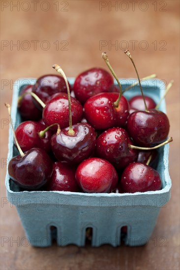 Close up of bing cherries in carton