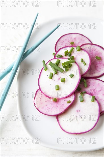 Sliced radishes on plate - Photo12-Tetra Images-Karen Beard