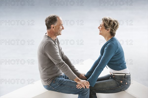 Couple sitting together on benches