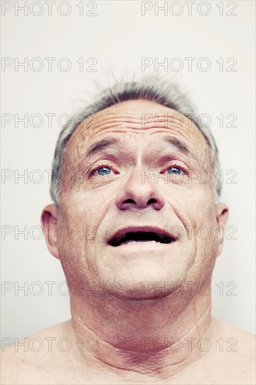 Older Caucasian man crying