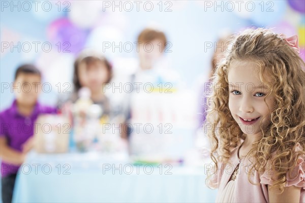 Girl smiling at birthday party