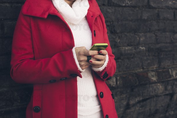 Caucasian woman using cell phone outdoors