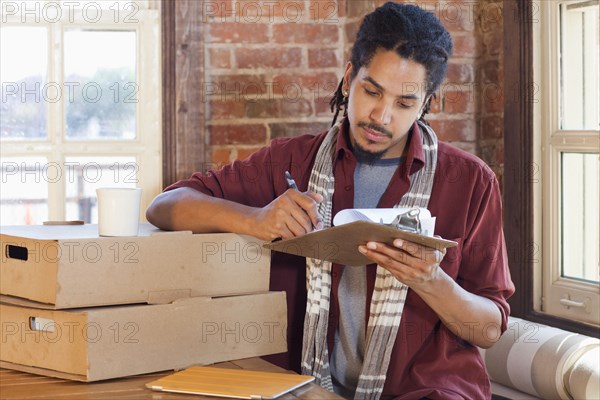 Mixed race man working in coffee shop