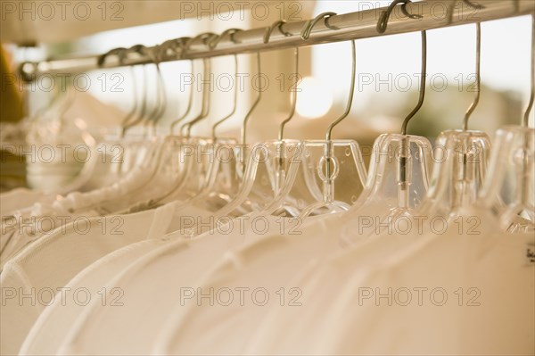 Close up of rack of clothes