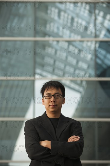 Asian businessman with arms crossed